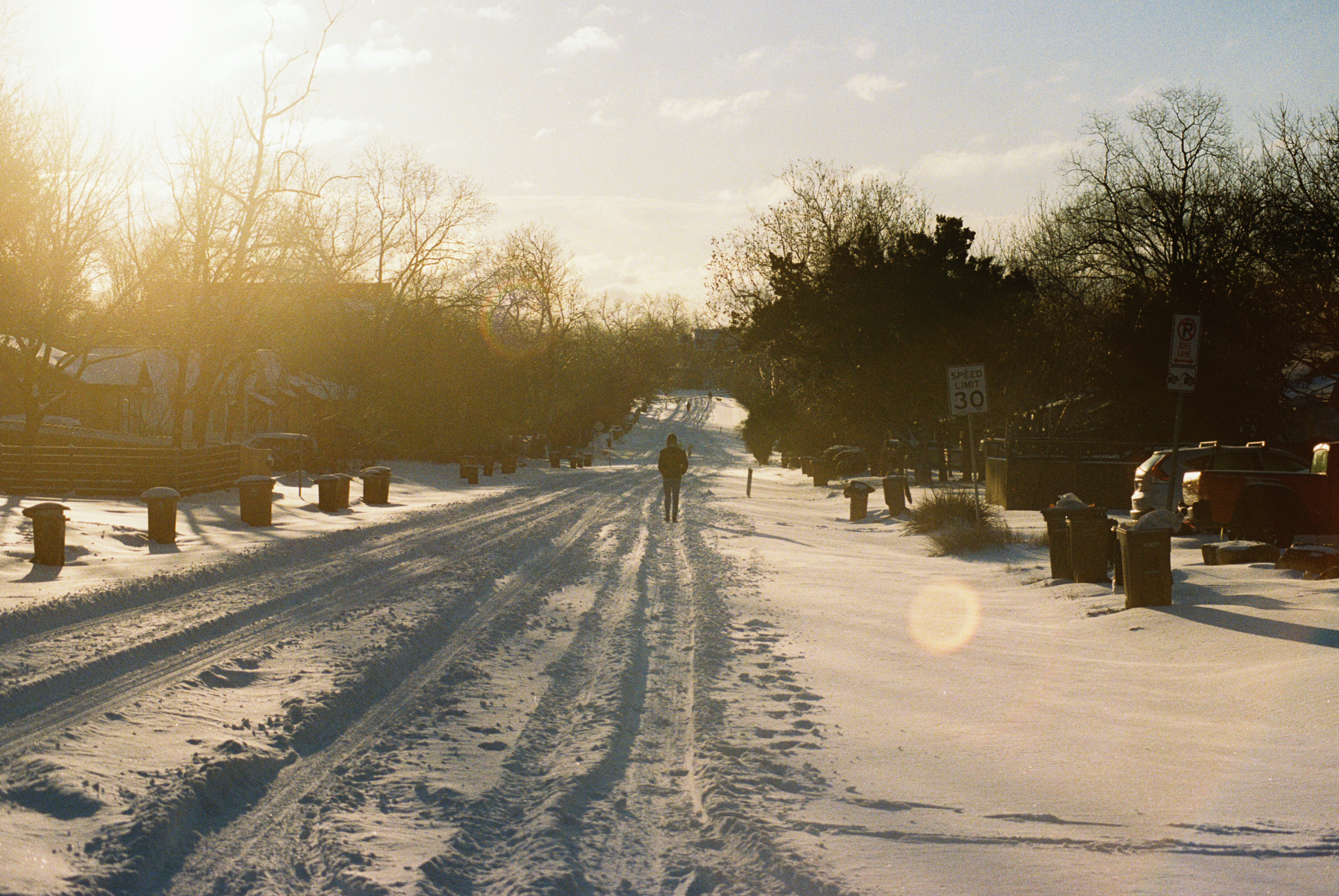 lone walker in snow covered street